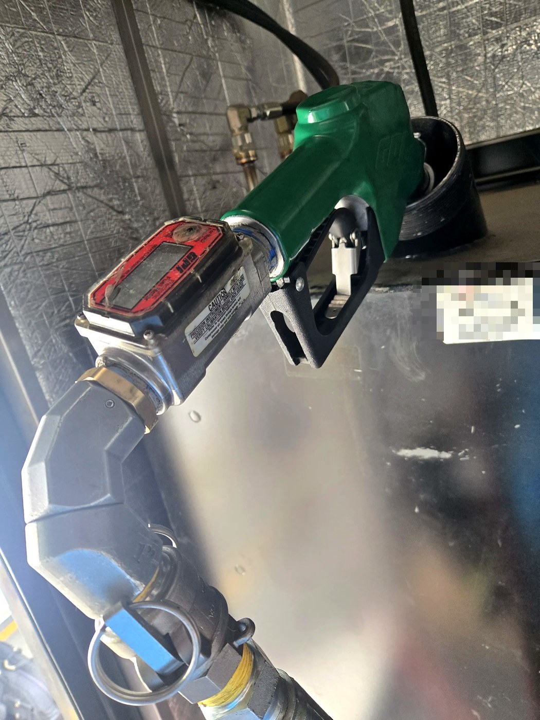 Digital fuel flow meter and nozzle close-up