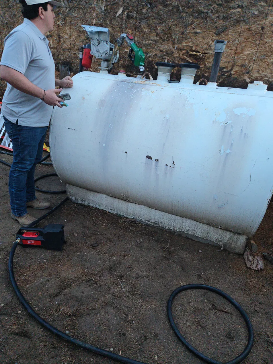 One of our partners inspecting the first fuel tank The Fuel Guys ever purchased
