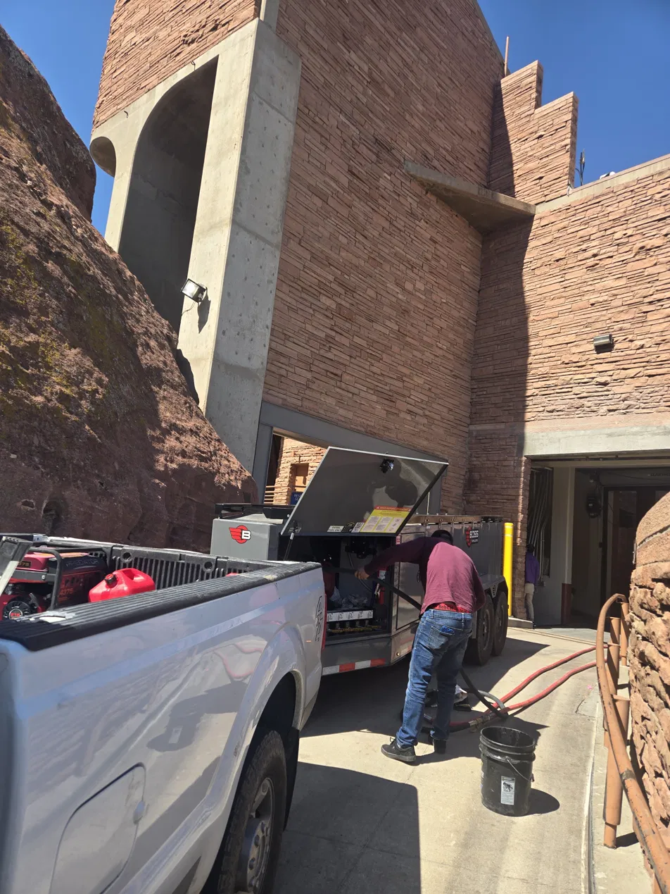 The Fuel Guys crew working a fuel hose at a major Colorado amphitheatre