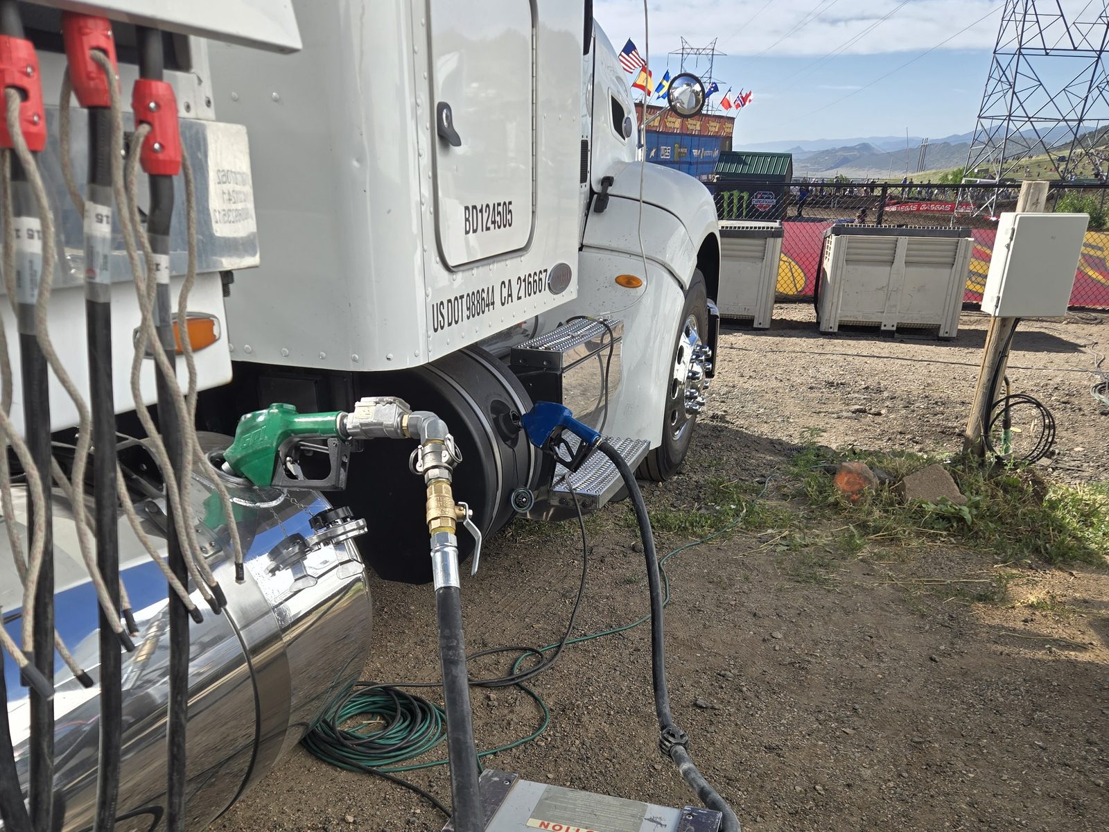 Green fuel nozzle in a broadcast truck's chrome saddle tank at Thunder Valley Motocross Park